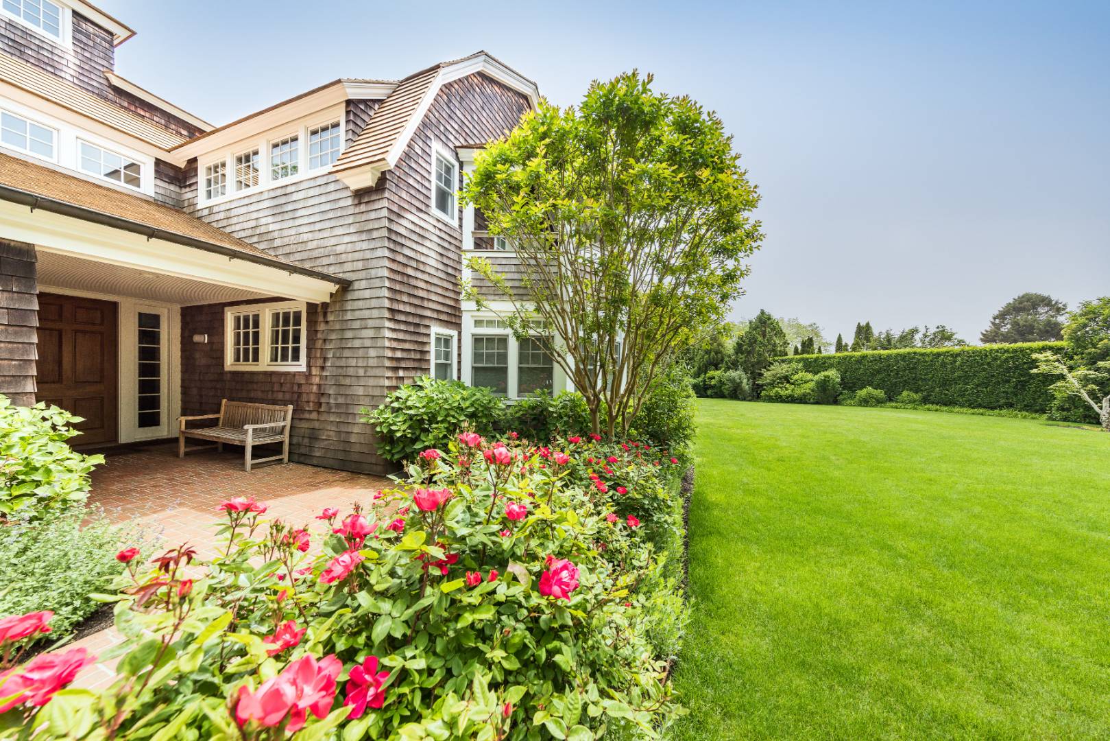 30 Jones Road East Hampton, NY 11937 - Photo 18 of 21 a flower plants in front of a house