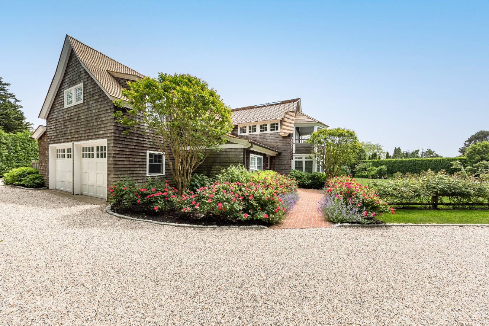 30 Jones Road East Hampton, NY 11937 - Photo 19 of 21 front view of a house with a yard