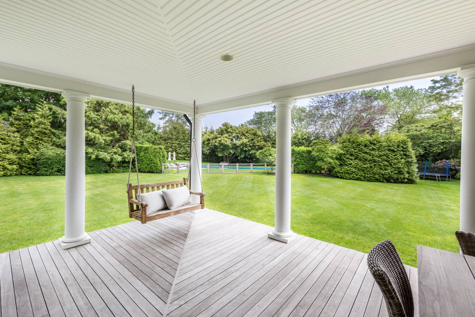 30 Jones Road East Hampton, NY 11937 - Photo 3 of 21 a view of a deck with chair and floor to ceiling window
