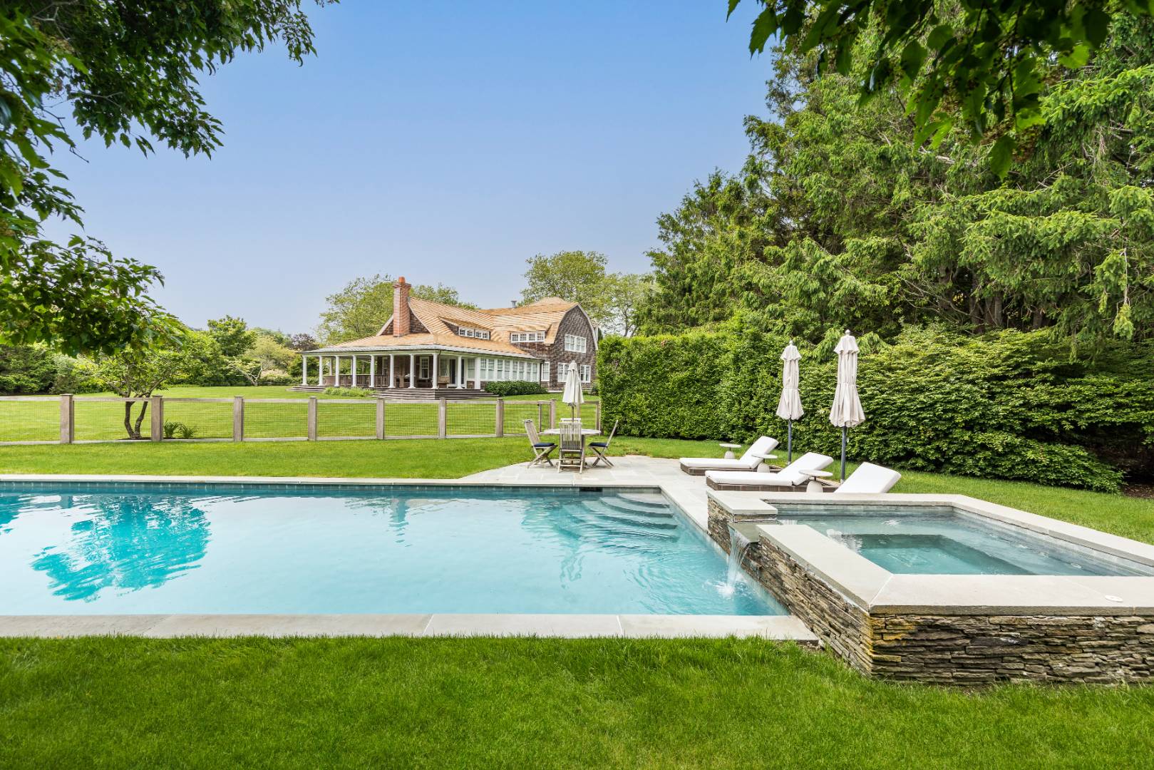 30 Jones Road East Hampton, NY 11937 - Photo 4 of 21 a view of a swimming pool with a yard