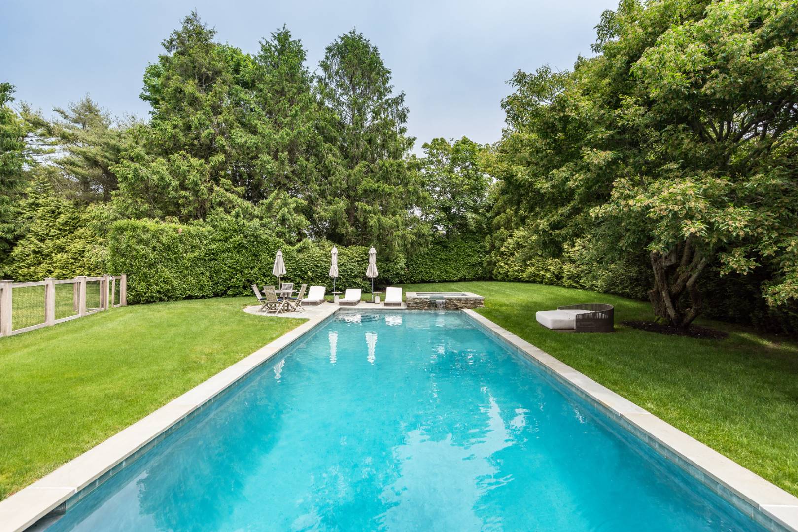 30 Jones Road East Hampton, NY 11937 - Photo 5 of 21 a view of a backyard with a large pool and large trees