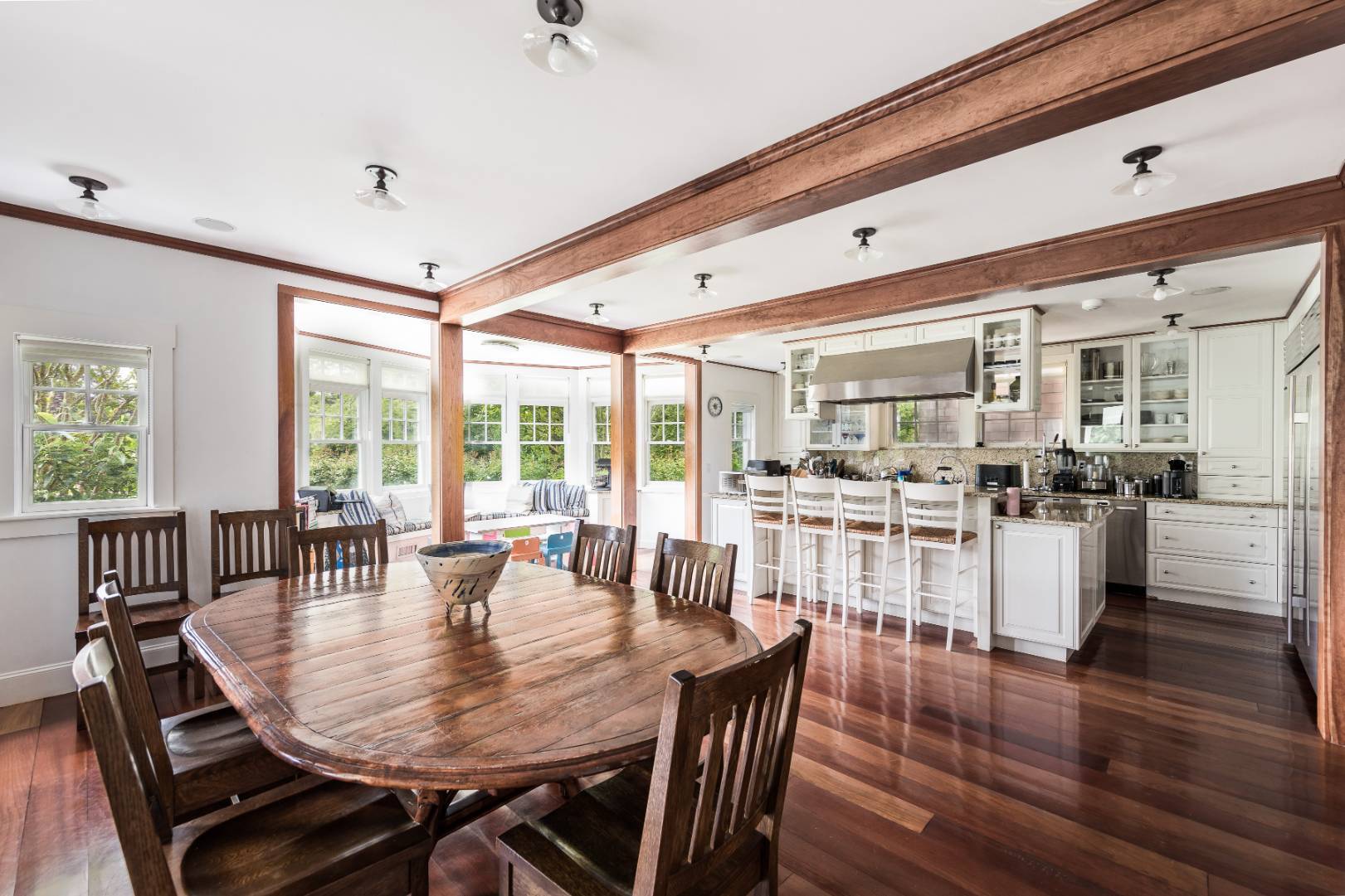 30 Jones Road East Hampton, NY 11937 - Photo 8 of 21 a dining room with furniture a chandelier and wooden floor