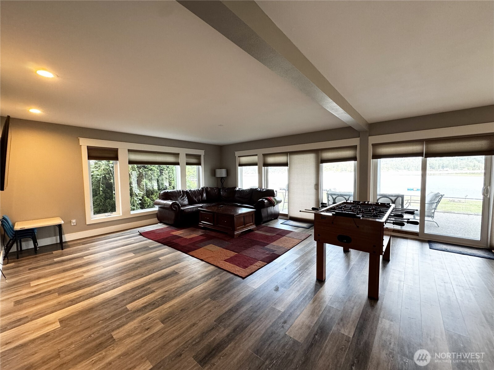 7360 East Grapeview Loop Road Allyn, WA 98524 - Photo 11 of 19 a living room with furniture and a wooden floor