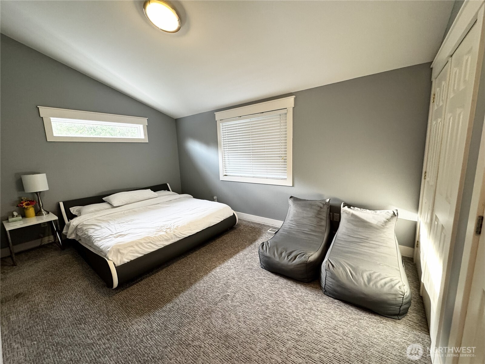 7360 East Grapeview Loop Road Allyn, WA 98524 - Photo 12 of 19 a bedroom with a bed and a window