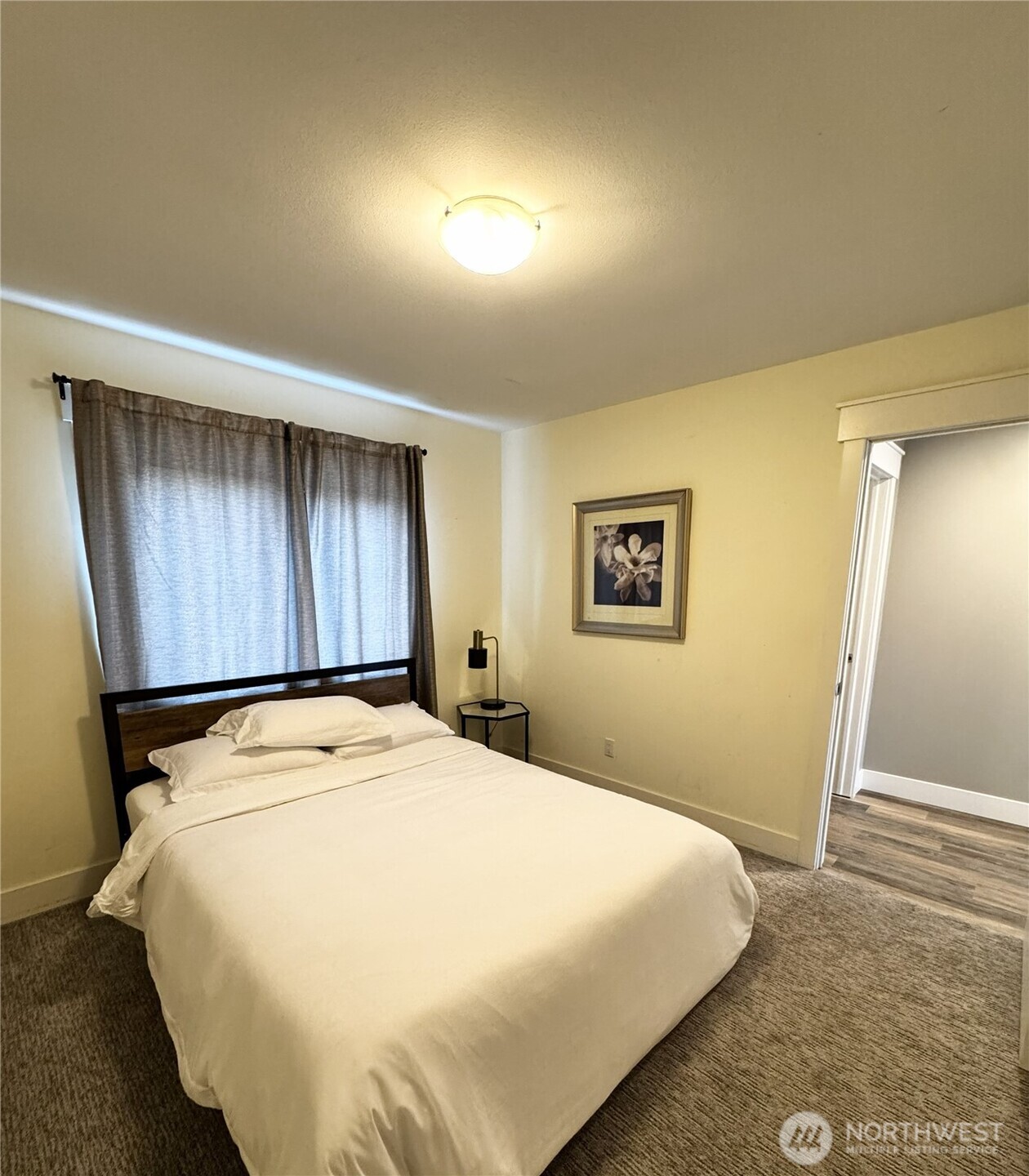 7360 East Grapeview Loop Road Allyn, WA 98524 - Photo 14 of 19 a bedroom with a bed and a window