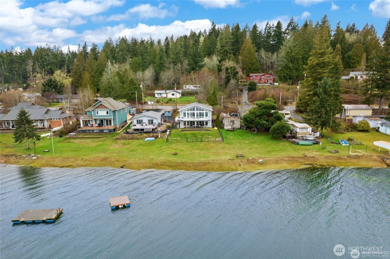 7360 East Grapeview Loop Road Allyn, WA 98524 - Photo 18 of 19 an aerial view of a house with yard swimming pool and outdoor seating