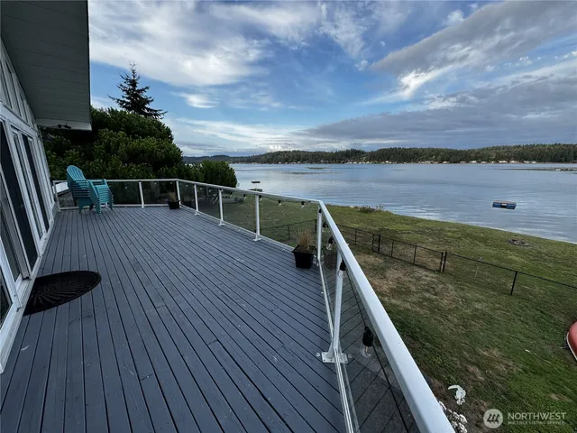a view of outdoor space with wooden floor and barbeque