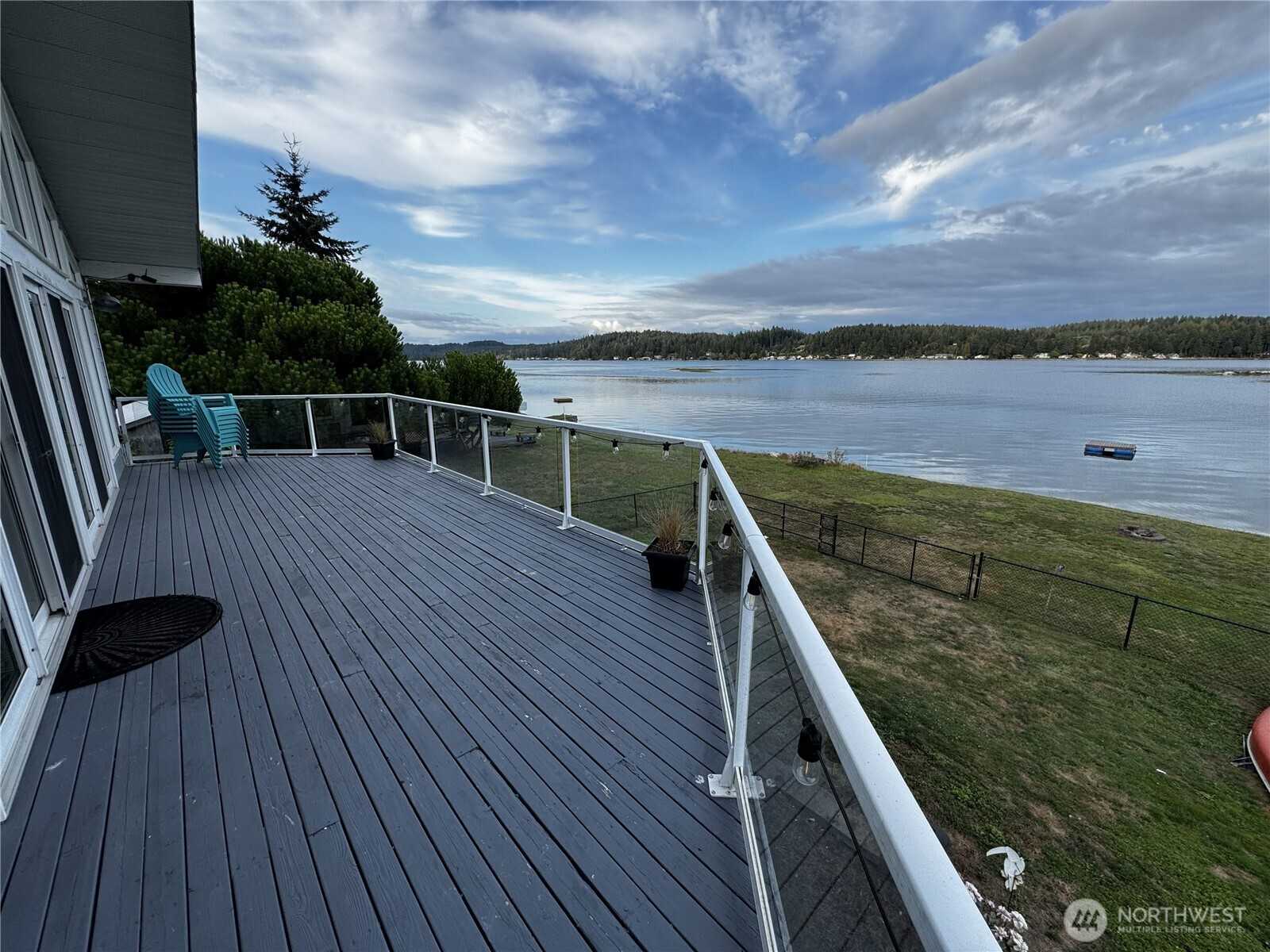 7360 East Grapeview Loop Road Allyn, WA 98524 - Photo 2 of 19 a view of outdoor space with wooden floor and barbeque