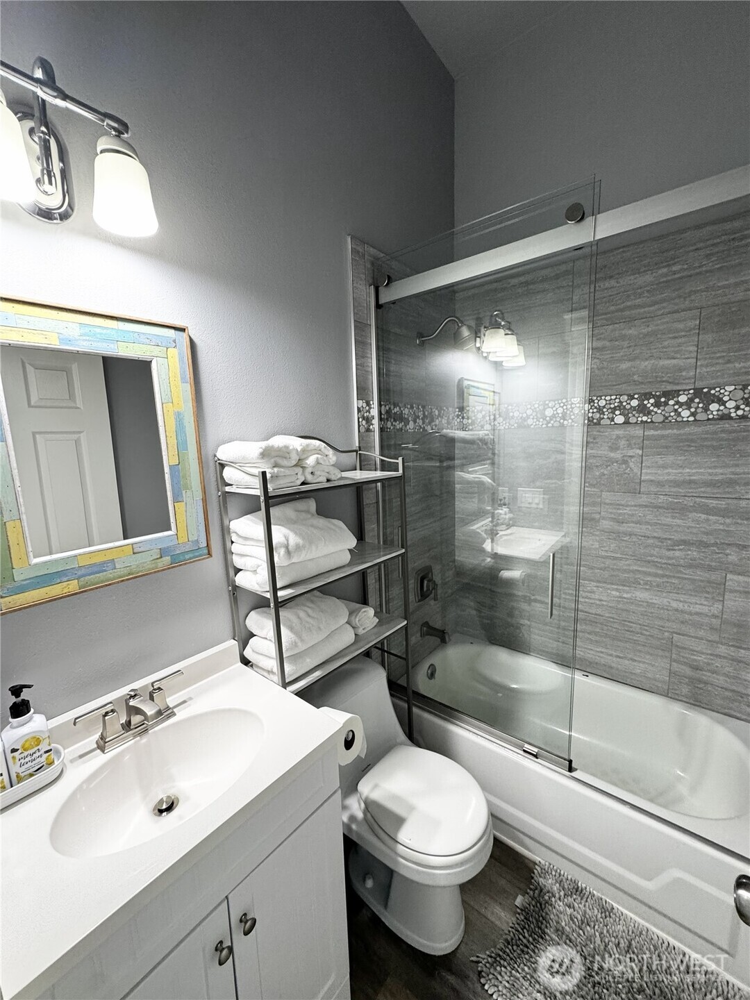 7360 East Grapeview Loop Road Allyn, WA 98524 - Photo 10 of 19 a bathroom with a sink toilet and shower