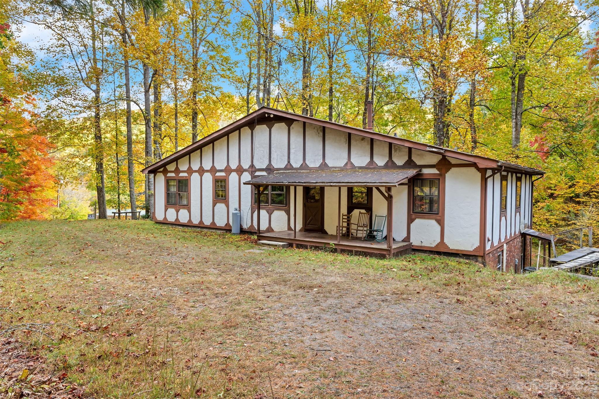 91 Chestnut Hill Road Black Mountain, NC 28711 - Photo 1 of 45 a view of a house with a yard and sitting area