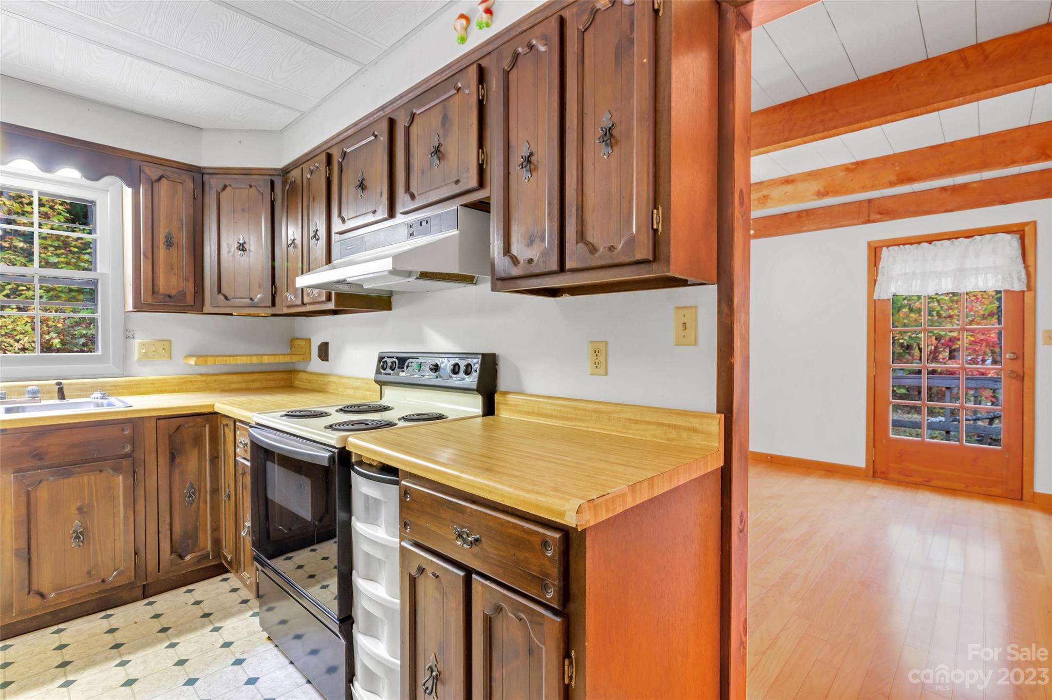 91 Chestnut Hill Road Black Mountain, NC 28711 - Photo 12 of 45 a kitchen with stainless steel appliances granite countertop a sink and a stove