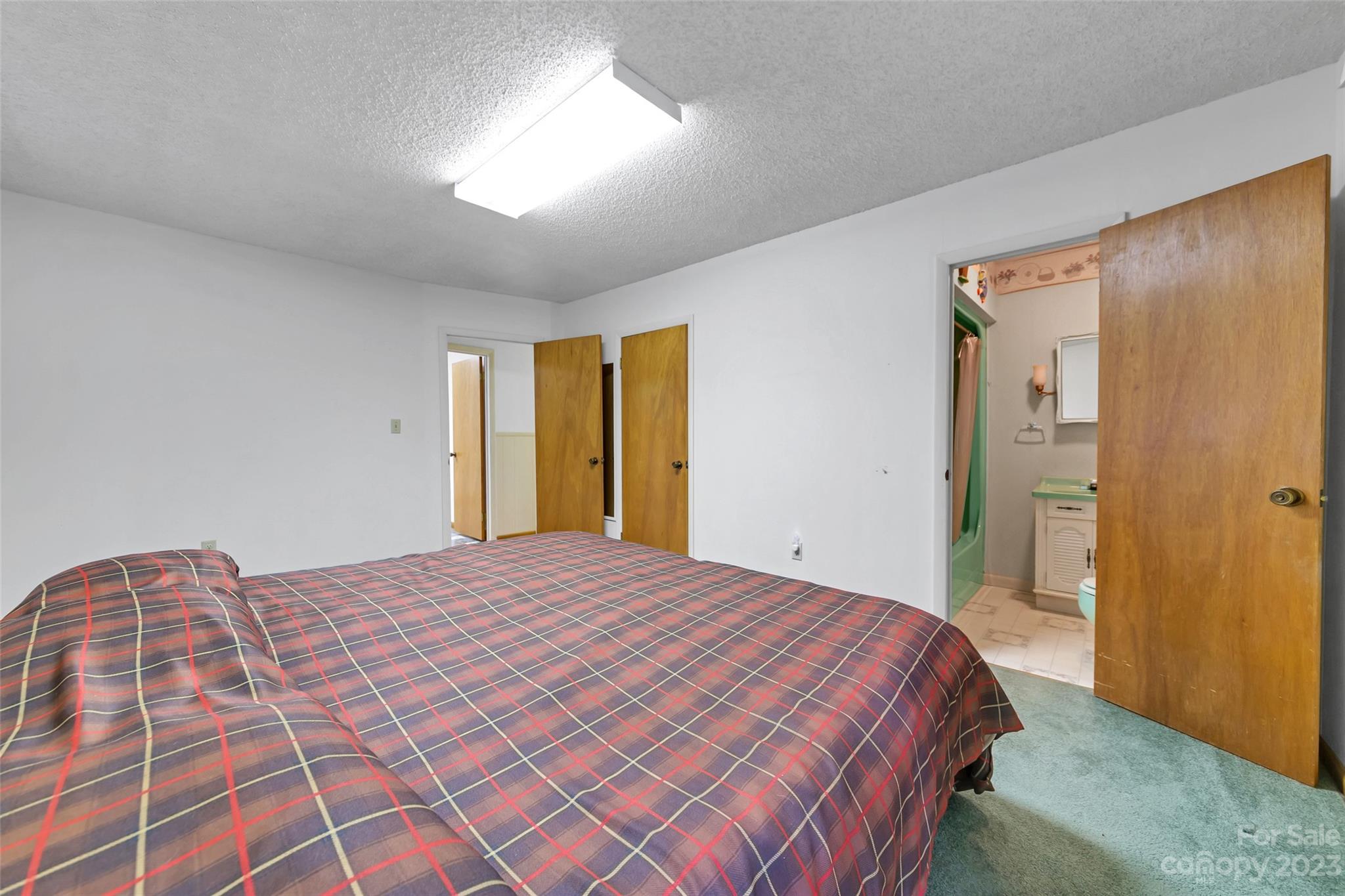91 Chestnut Hill Road Black Mountain, NC 28711 - Photo 18 of 45 a bedroom with a bed and a dresser