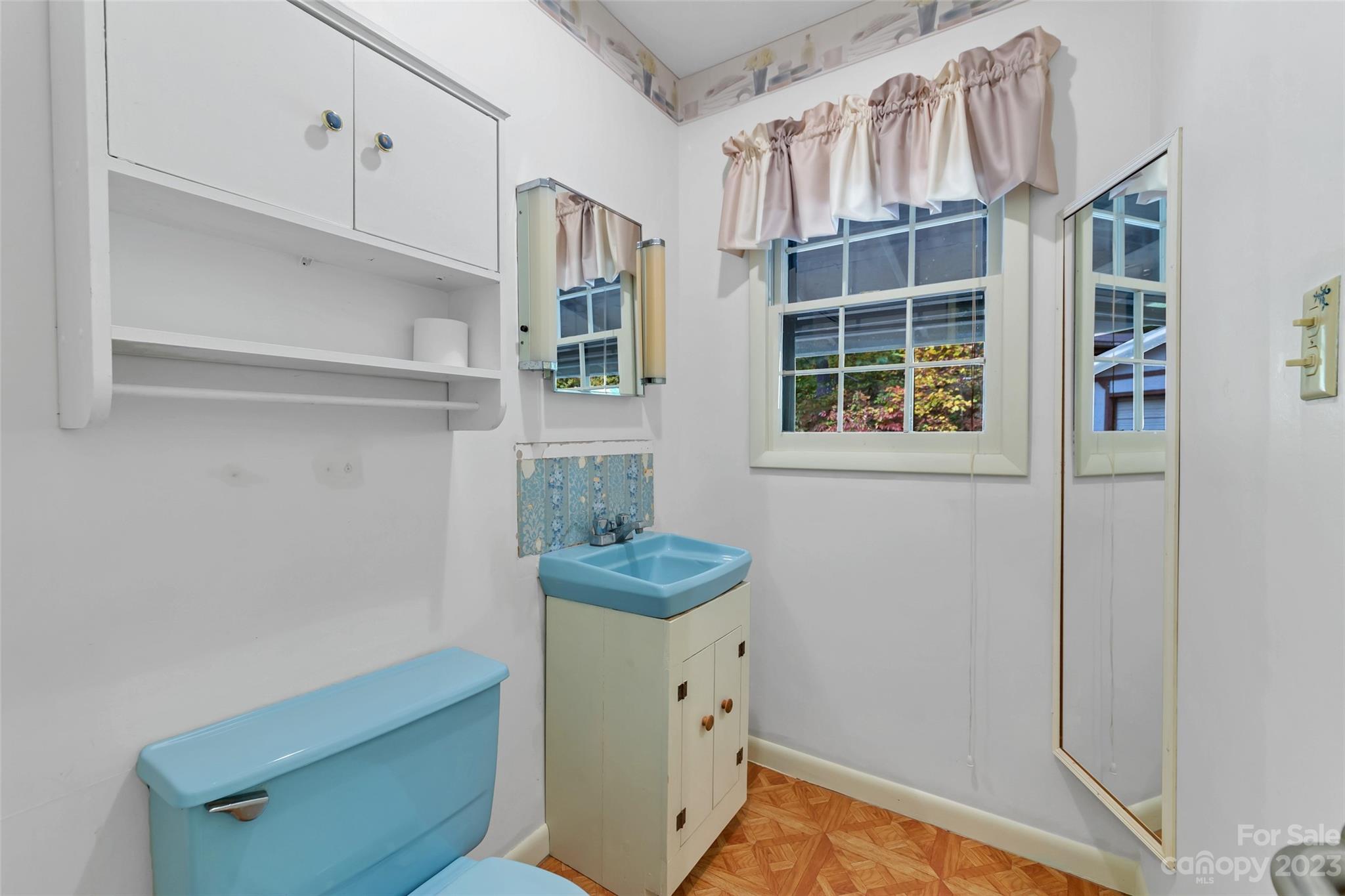 91 Chestnut Hill Road Black Mountain, NC 28711 - Photo 21 of 45 a view of hallway with window and wooden cabinets
