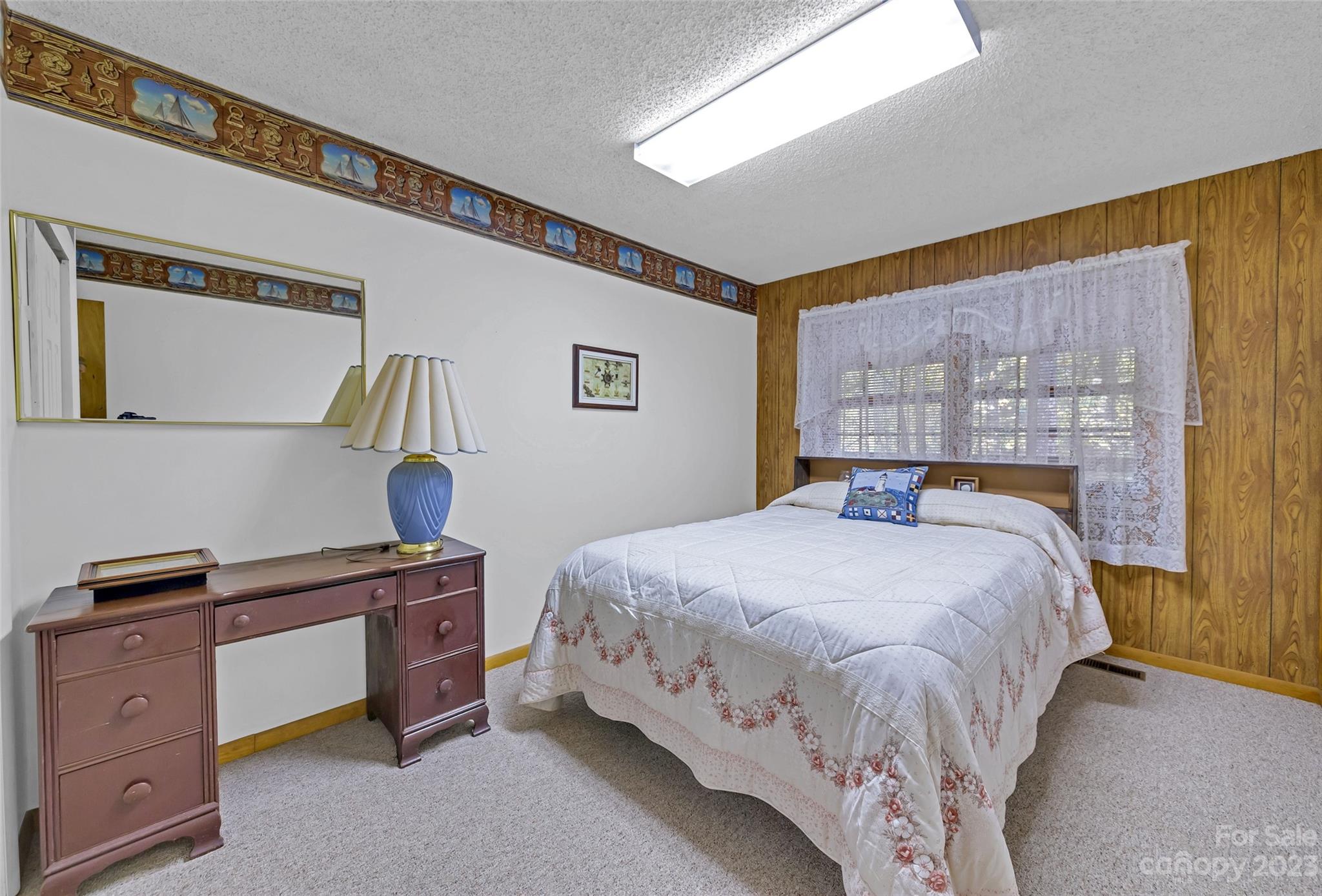 91 Chestnut Hill Road Black Mountain, NC 28711 - Photo 22 of 45 a bedroom with a bed and a window