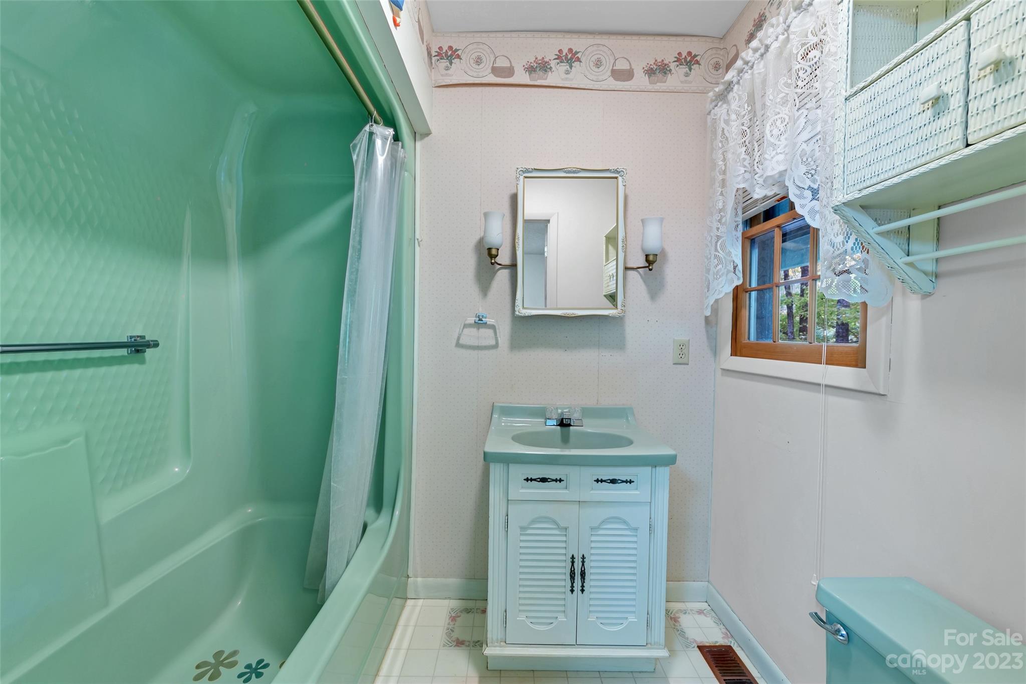 91 Chestnut Hill Road Black Mountain, NC 28711 - Photo 26 of 45 a room with cabinets and a wooden door