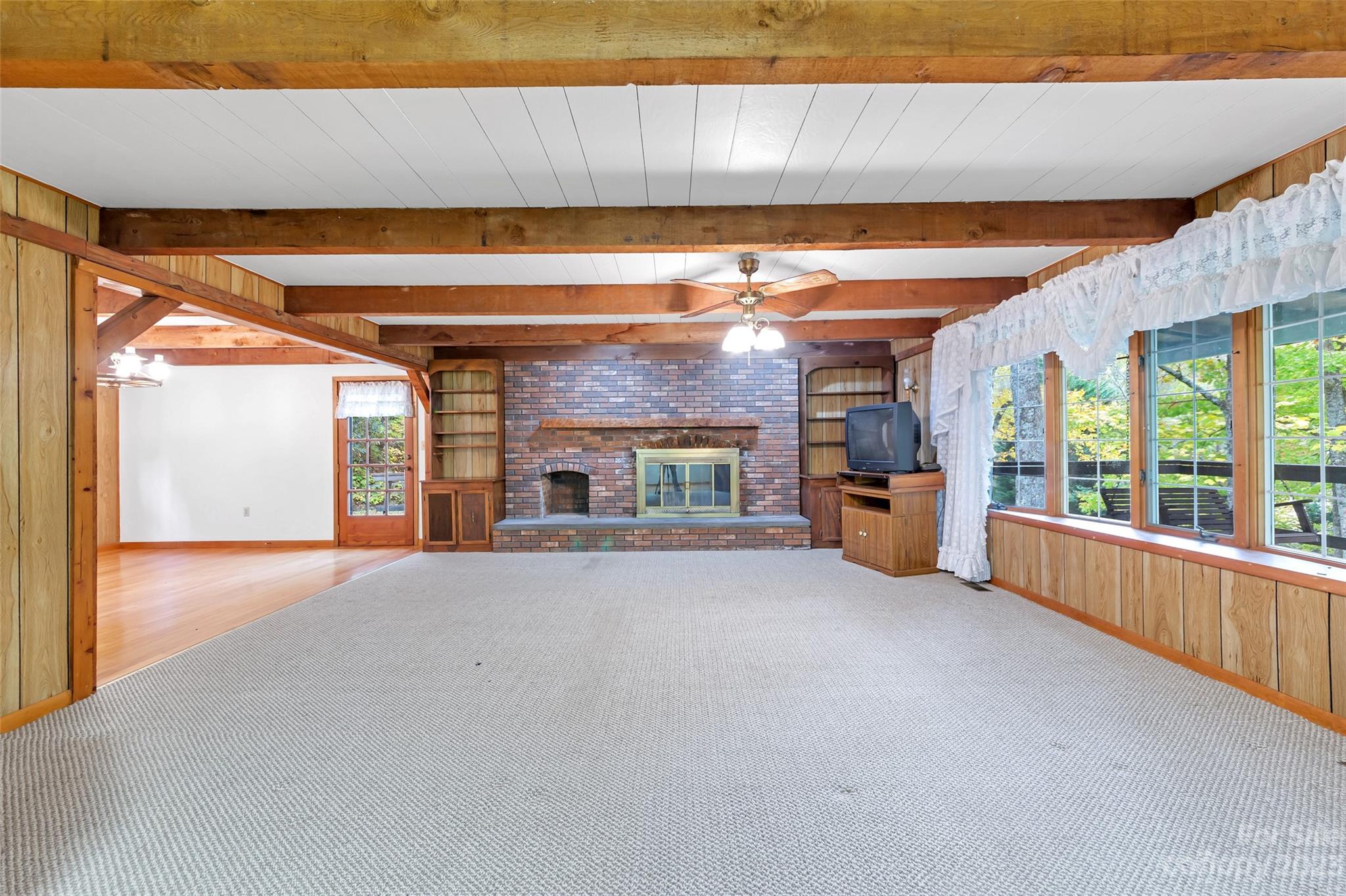 91 Chestnut Hill Road Black Mountain, NC 28711 - Photo 6 of 45 a view of an empty room with a fireplace