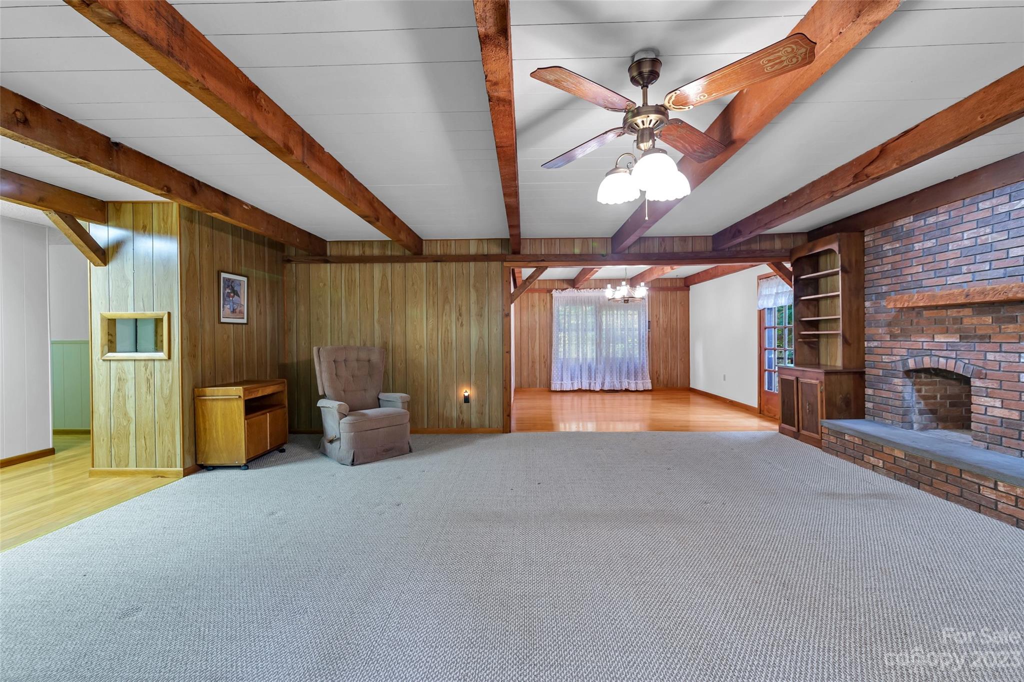 91 Chestnut Hill Road Black Mountain, NC 28711 - Photo 8 of 45 a view of a livingroom with furniture and a ceiling fan