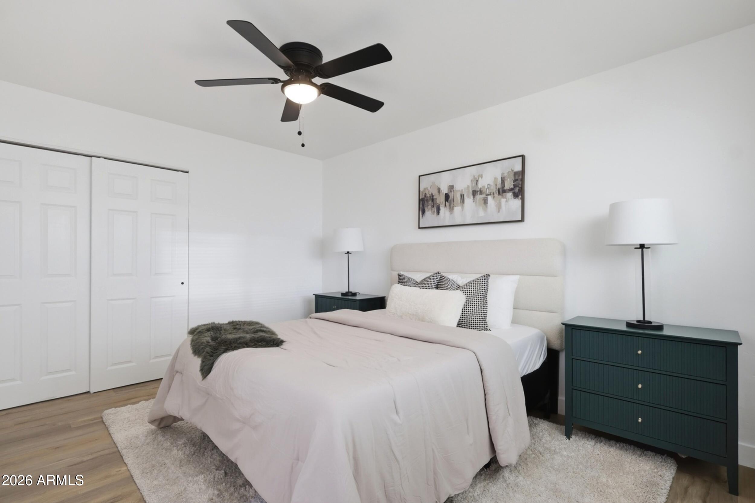 1555 West 6th Street Tempe, AZ 85281 - Photo 18 of 40 a bedroom with a bed and a painting on the wall
