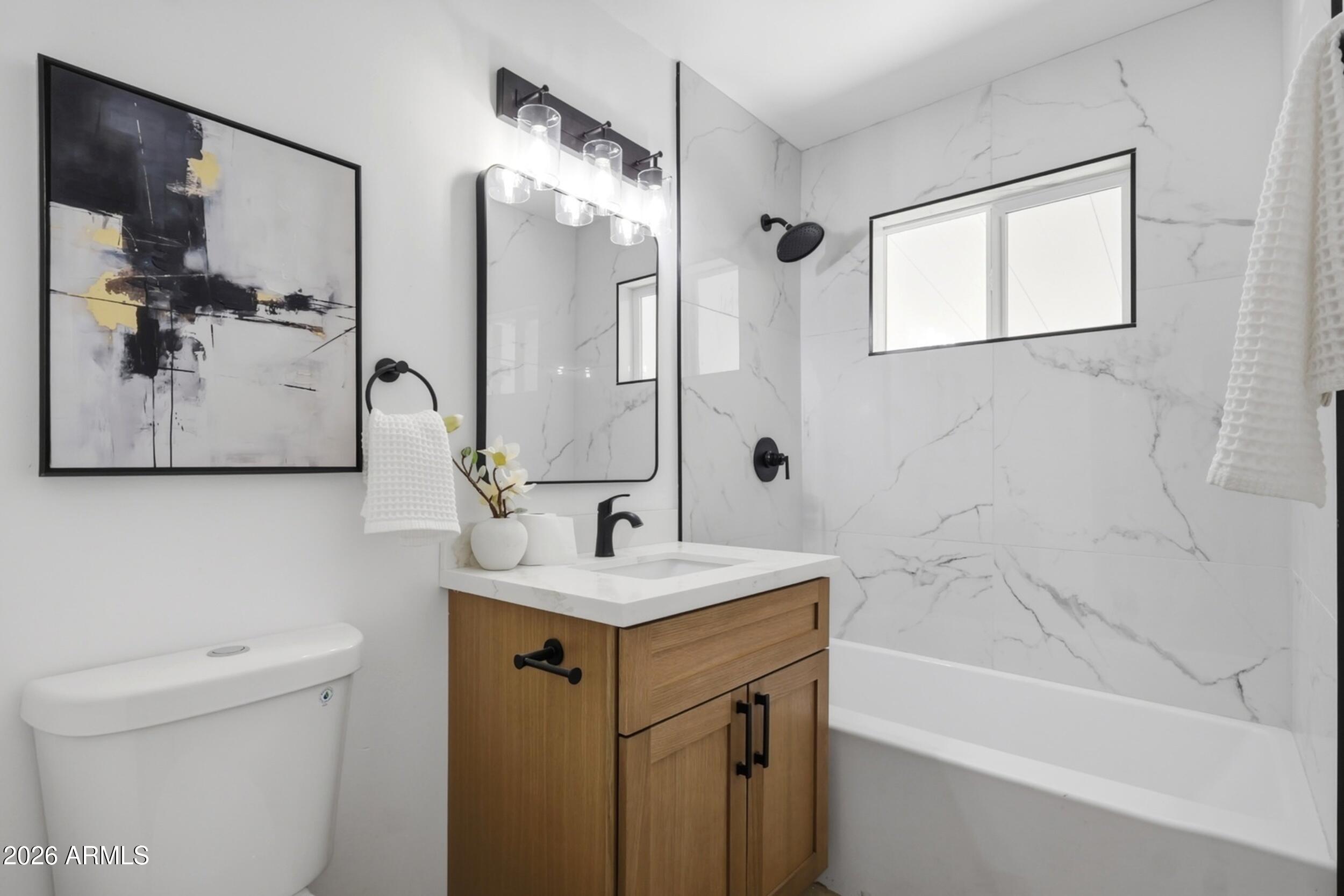1555 West 6th Street Tempe, AZ 85281 - Photo 20 of 40 a bathroom with a sink a toilet and shower