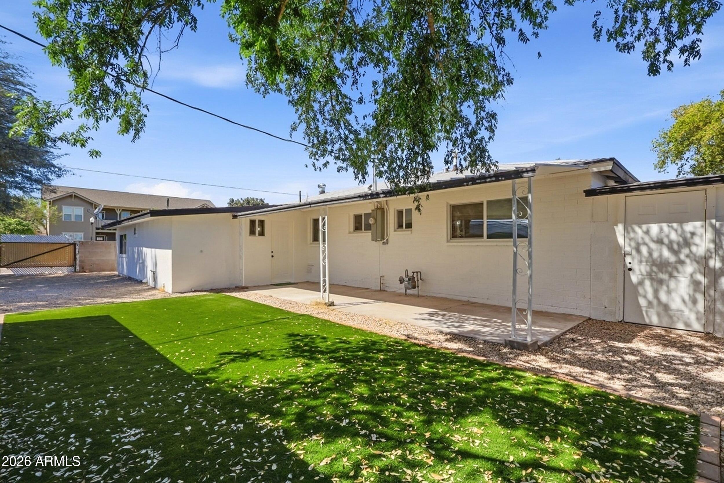 1555 West 6th Street Tempe, AZ 85281 - Photo 39 of 40 a backyard of a house with lots of green space