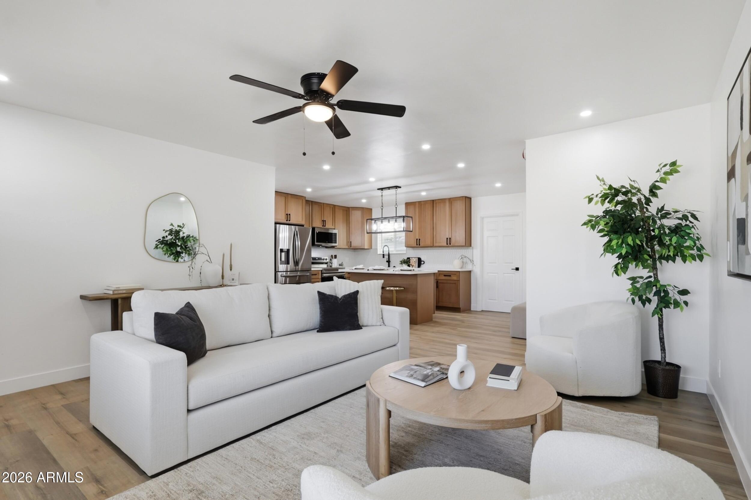 1555 West 6th Street Tempe, AZ 85281 - Photo 6 of 40 a living room with furniture and a potted plant