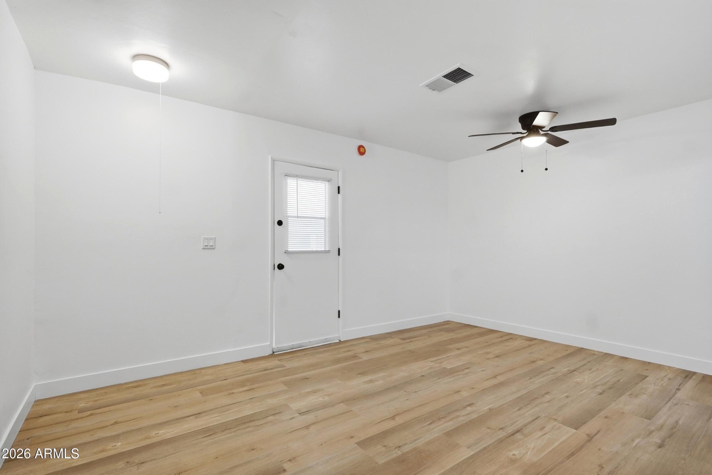 1555 West 6th Street Tempe, AZ 85281 - Photo 7 of 40 wooden floor in an empty room