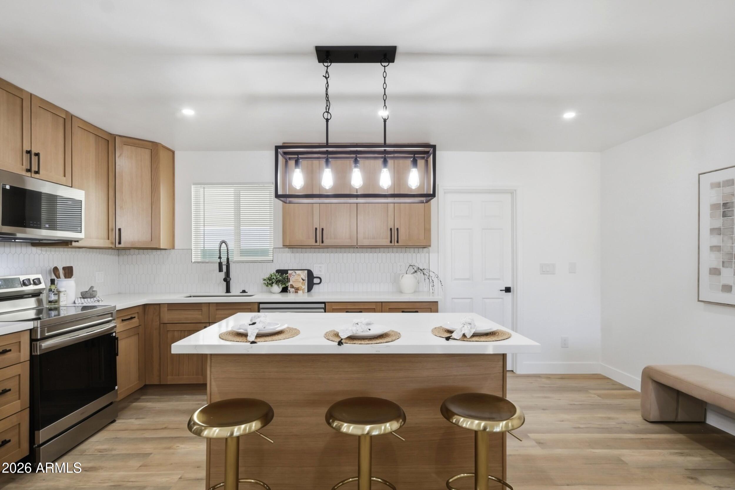 1555 West 6th Street Tempe, AZ 85281 - Photo 9 of 40 a kitchen with a sink cabinets and window