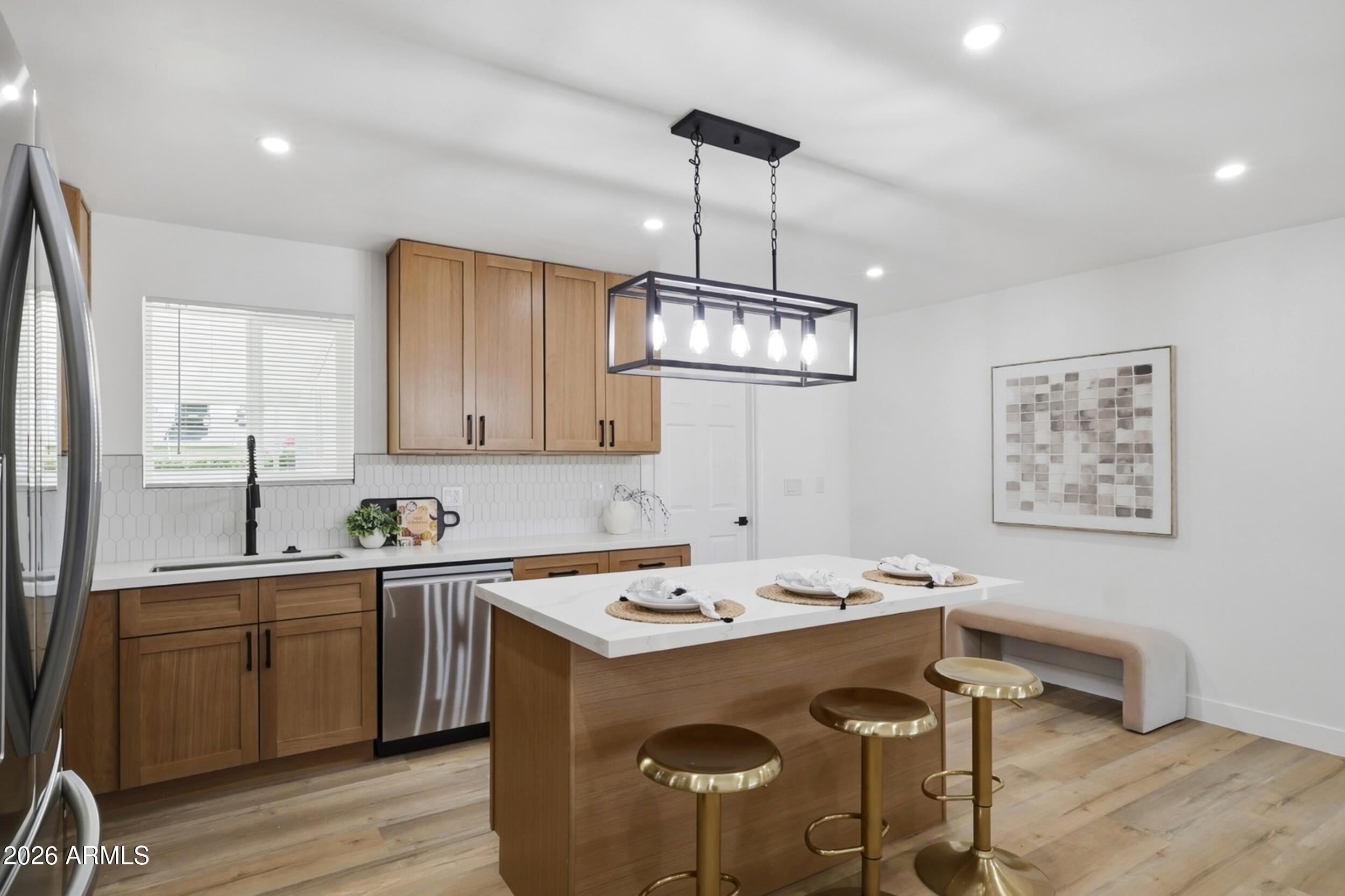 1555 West 6th Street Tempe, AZ 85281 - Photo 10 of 40 a very nice looking dining room with a table chairs and chandelier