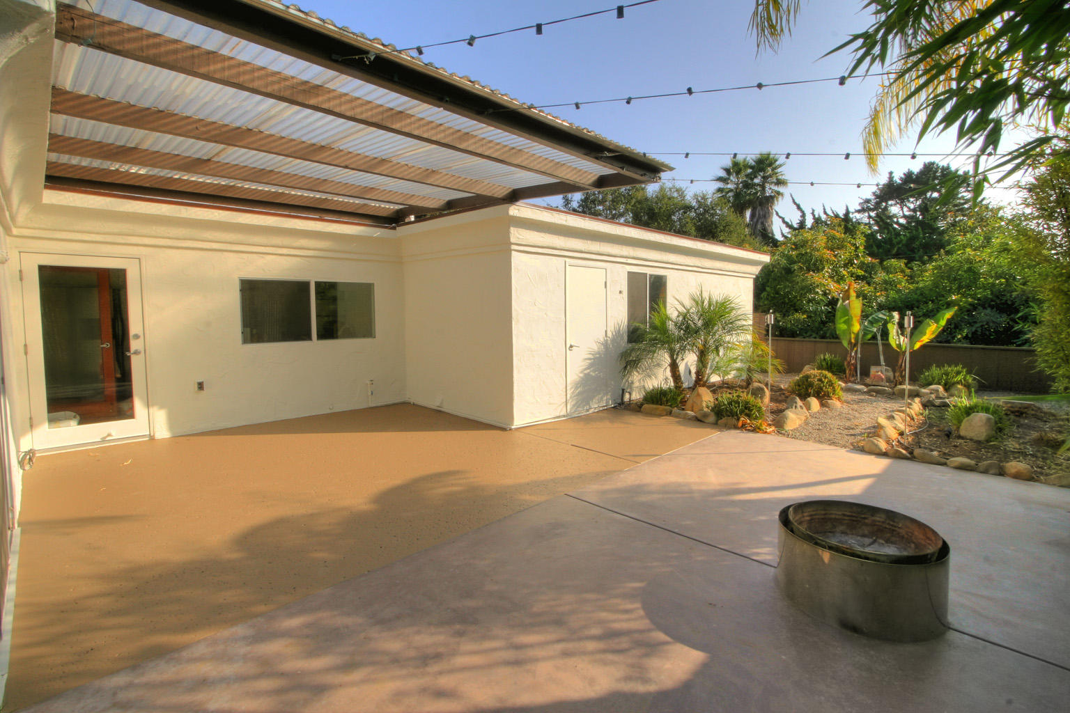 1275 Vallecito Road Carpinteria, CA 93013 - Photo 11 of 11 a backyard of a house with table and chairs