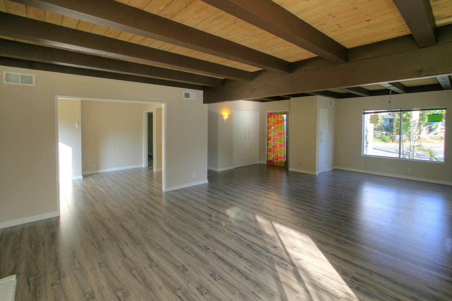 1275 Vallecito Road Carpinteria, CA 93013 - Photo 2 of 11 a view of an empty room with wooden floor and a window