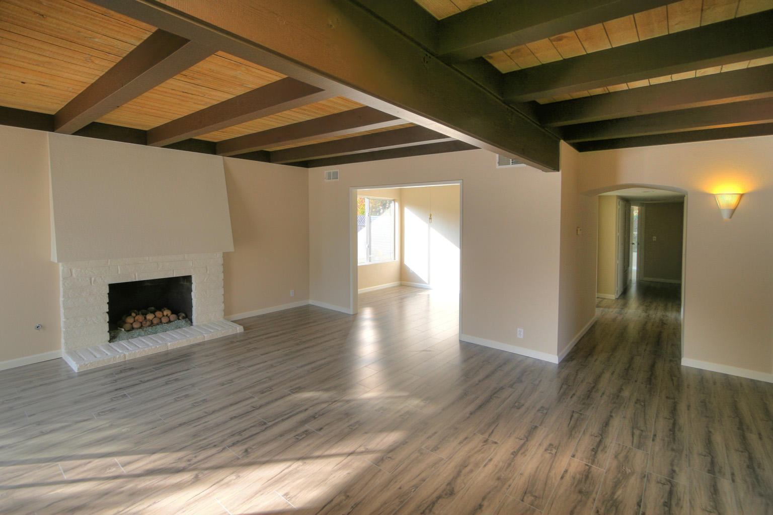 1275 Vallecito Road Carpinteria, CA 93013 - Photo 3 of 11 a view of an empty room with wooden floor and a window
