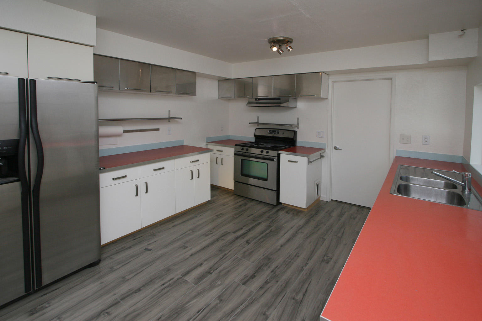 1275 Vallecito Road Carpinteria, CA 93013 - Photo 5 of 11 a kitchen with stainless steel appliances a refrigerator and a stove top oven