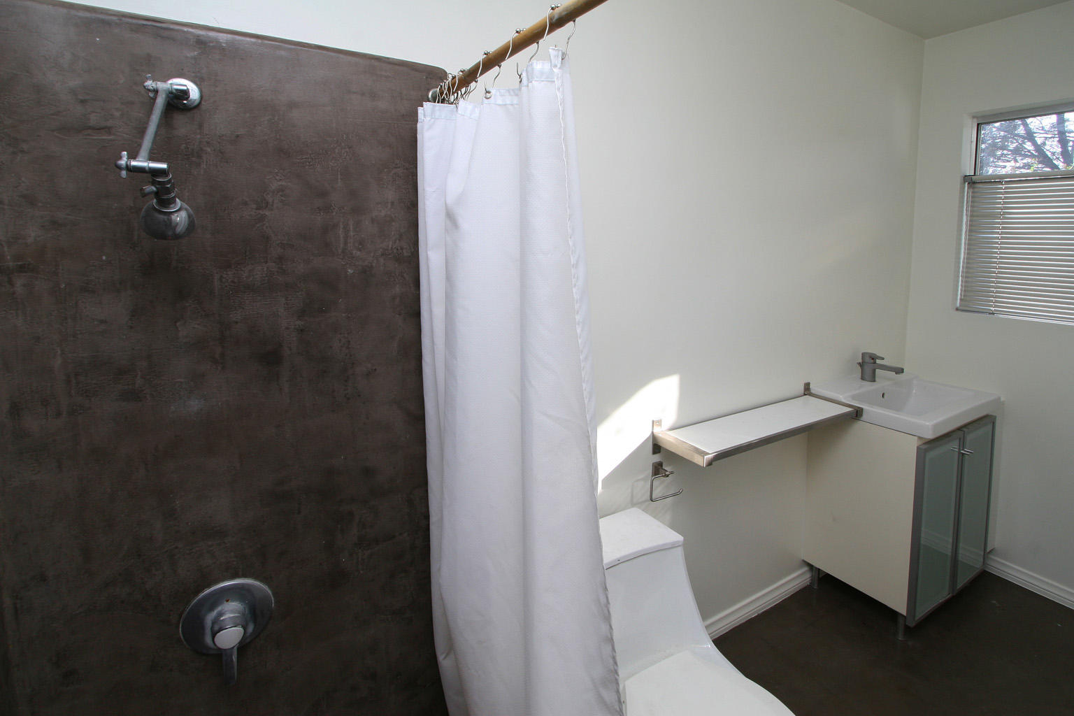 1275 Vallecito Road Carpinteria, CA 93013 - Photo 7 of 11 a bathroom with a shower and toilet