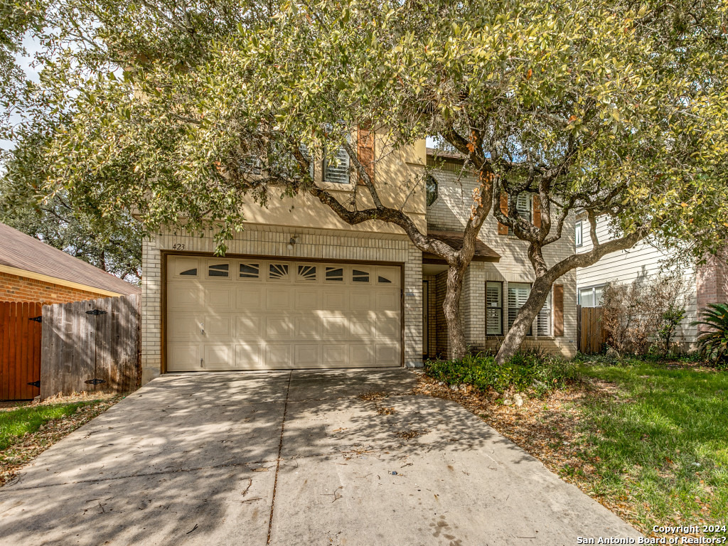 423 Irongate Ridge San Antonio, TX 78253 - Photo 1 of 1 a front view of a house with a yard