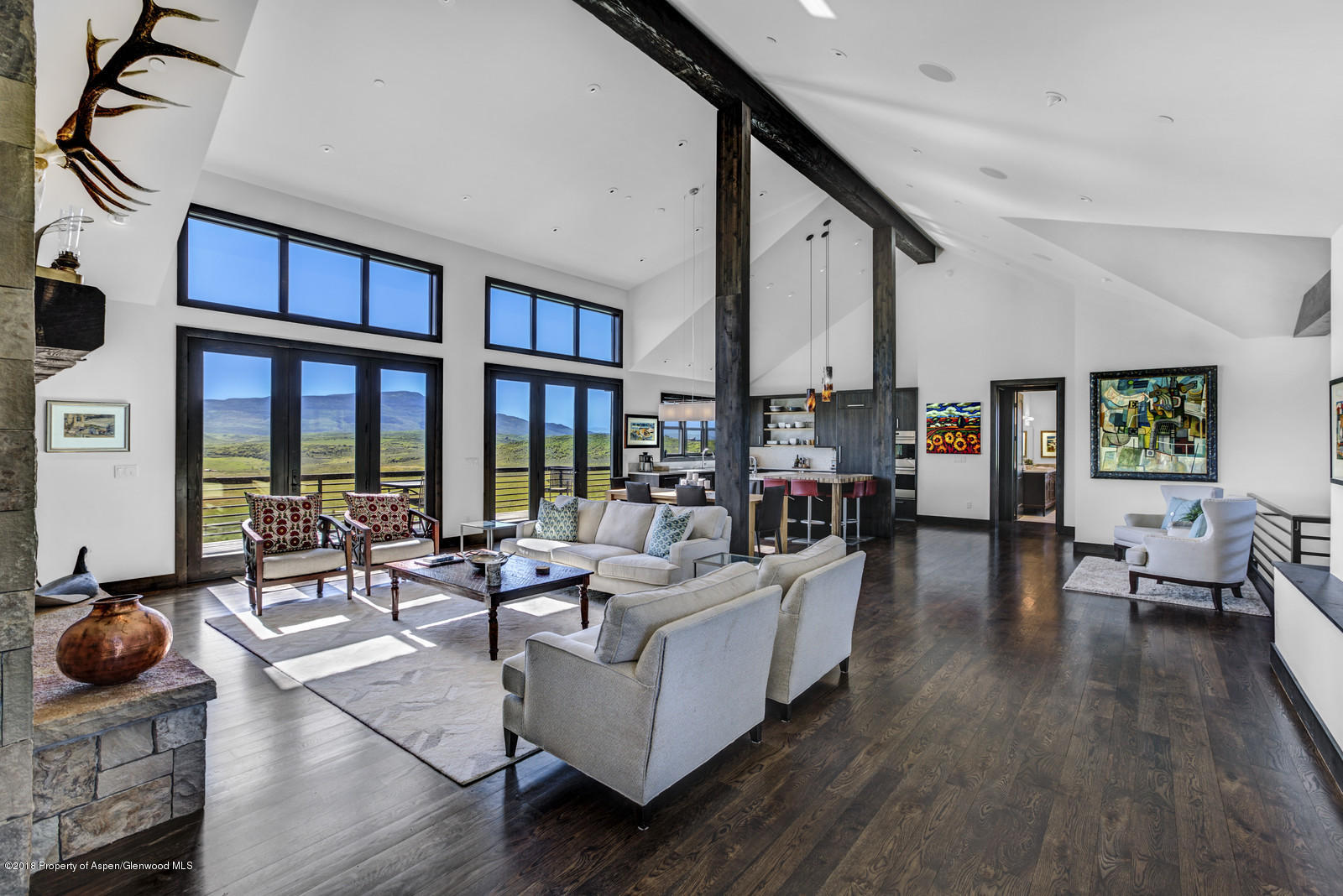 1003 Cattle Creek Ridge Road Carbondale, CO 81623 - Photo 2 of 57 a living room with furniture and floor to ceiling windows