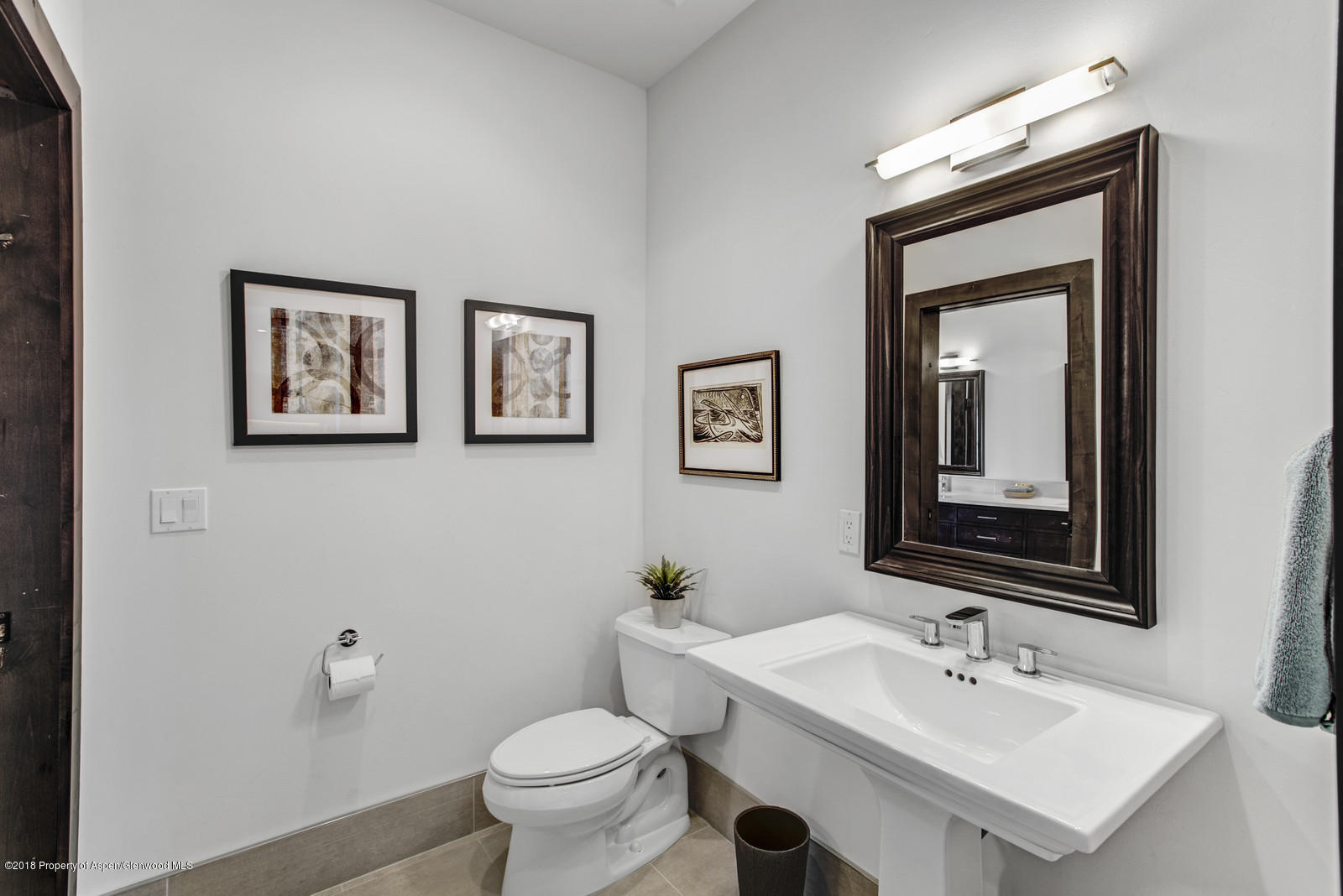 1003 Cattle Creek Ridge Road Carbondale, CO 81623 - Photo 29 of 57 a bathroom with a toilet sink and mirror