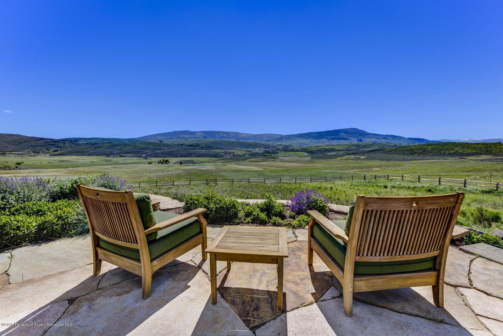 1003 Cattle Creek Ridge Road Carbondale, CO 81623 - Photo 38 of 57 a view of a chairs and table on the terrace