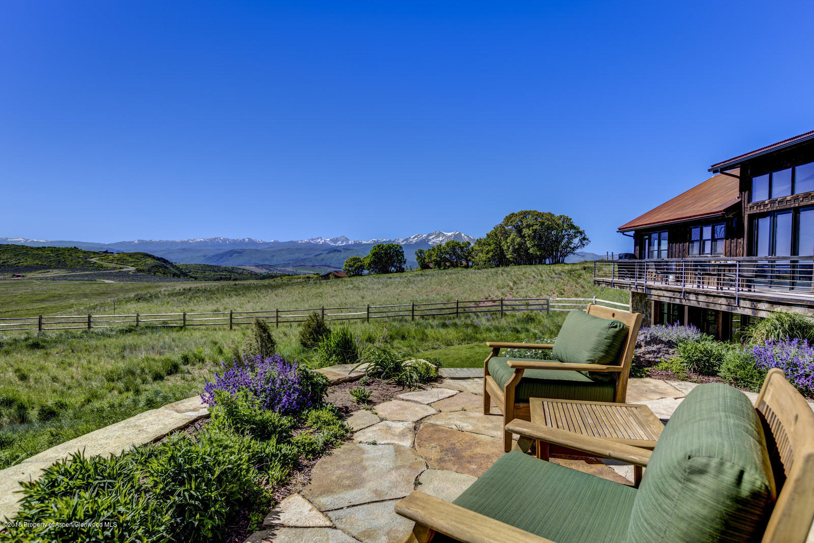 1003 Cattle Creek Ridge Road Carbondale, CO 81623 - Photo 40 of 57 a view of a chairs and table in the garden