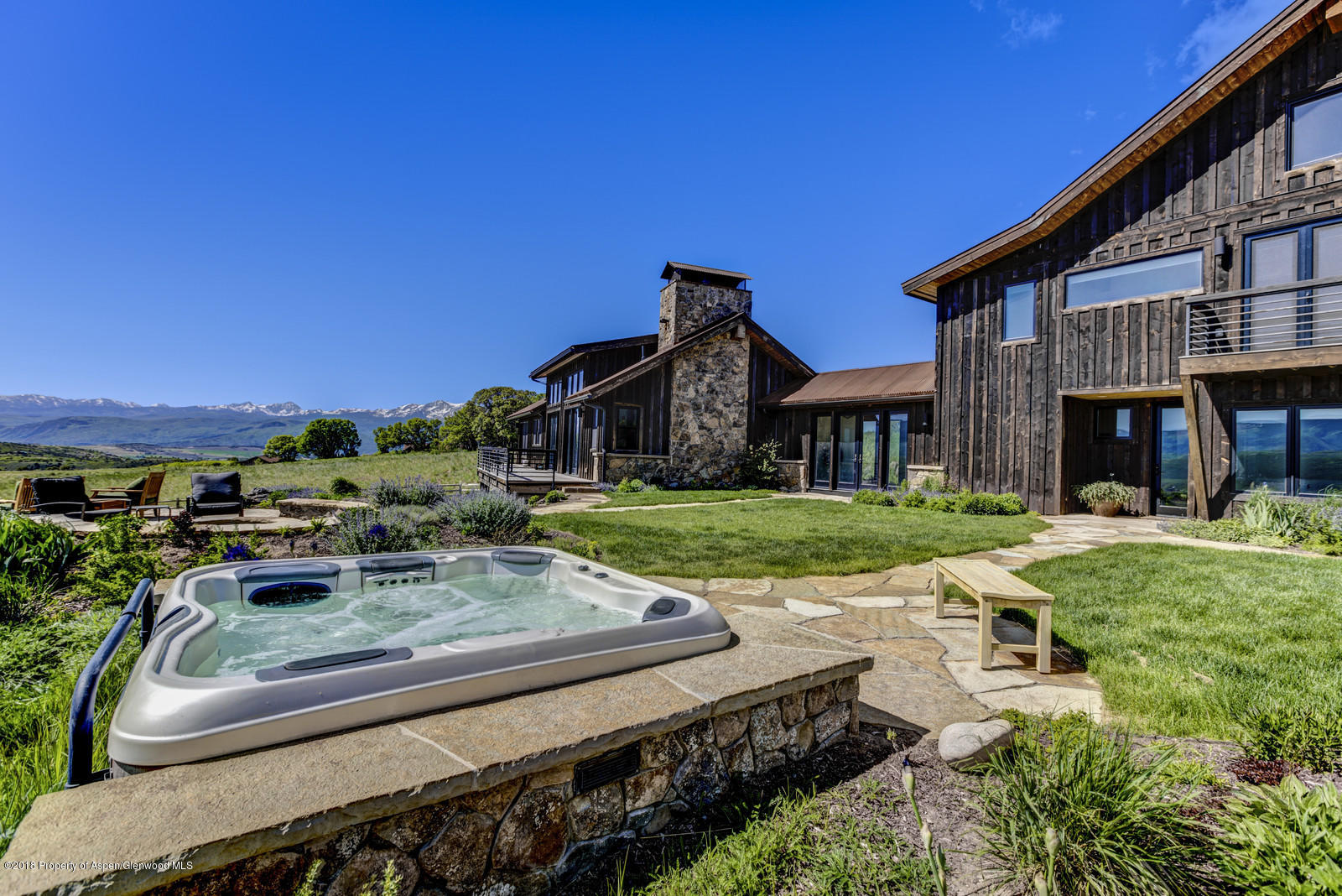 1003 Cattle Creek Ridge Road Carbondale, CO 81623 - Photo 42 of 57 a view of a house with backyard porch and sitting area