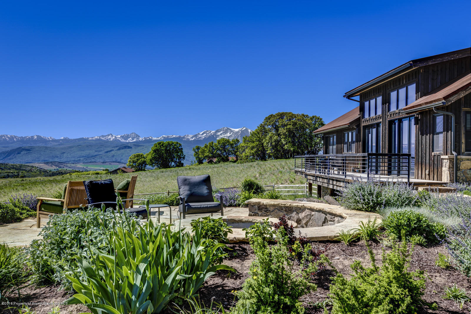 1003 Cattle Creek Ridge Road Carbondale, CO 81623 - Photo 43 of 57 a view of a house with pool and outdoor seating