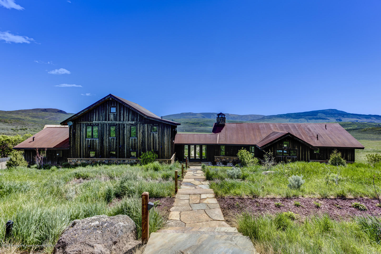 1003 Cattle Creek Ridge Road Carbondale, CO 81623 - Photo 44 of 57 a front view of house with yard and green space