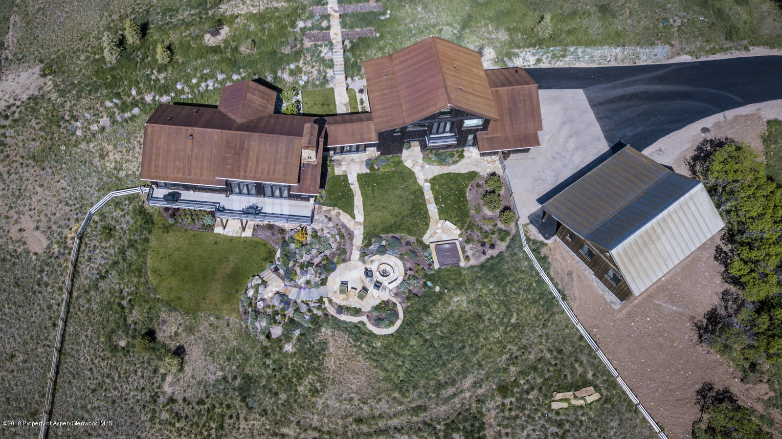 1003 Cattle Creek Ridge Road Carbondale, CO 81623 - Photo 48 of 57 an aerial view of a house with garden space and a car park in front of it