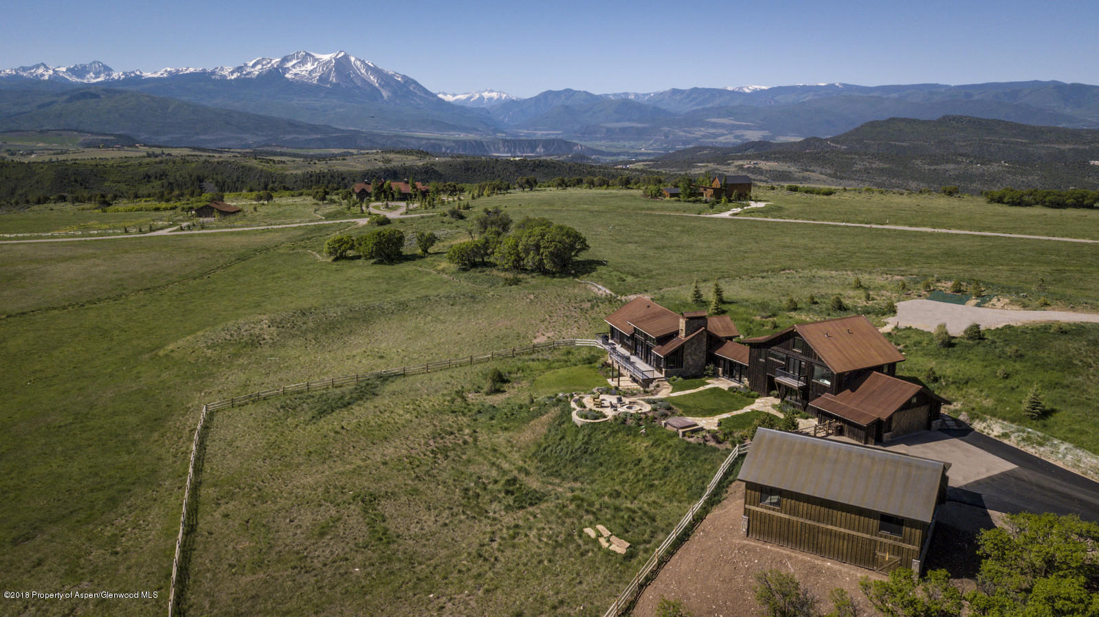1003 Cattle Creek Ridge Road Carbondale, CO 81623 - Photo 50 of 57 an aerial view of a house with a garden