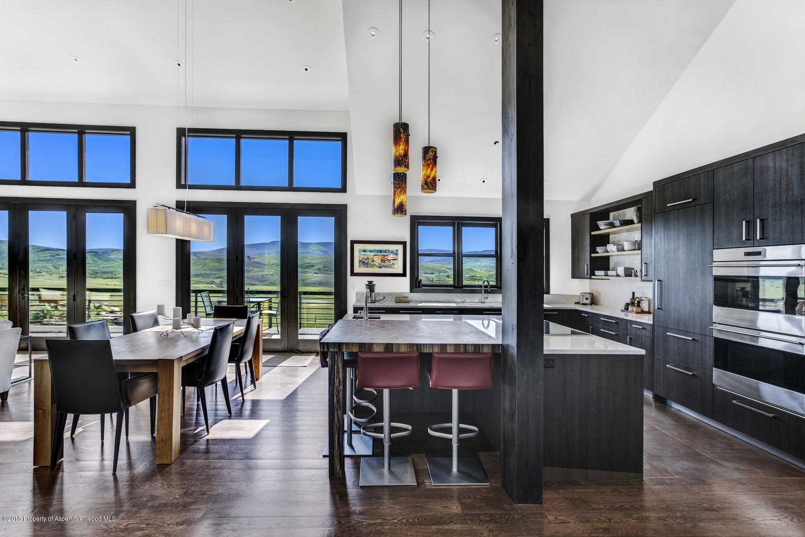 1003 Cattle Creek Ridge Road Carbondale, CO 81623 - Photo 5 of 57 a view of a dining room with furniture window and wooden floor