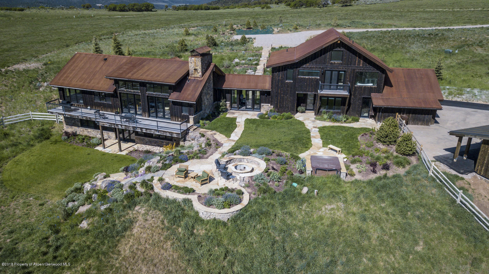 1003 Cattle Creek Ridge Road Carbondale, CO 81623 - Photo 54 of 57 a aerial view of a house with swimming pool garden and patio