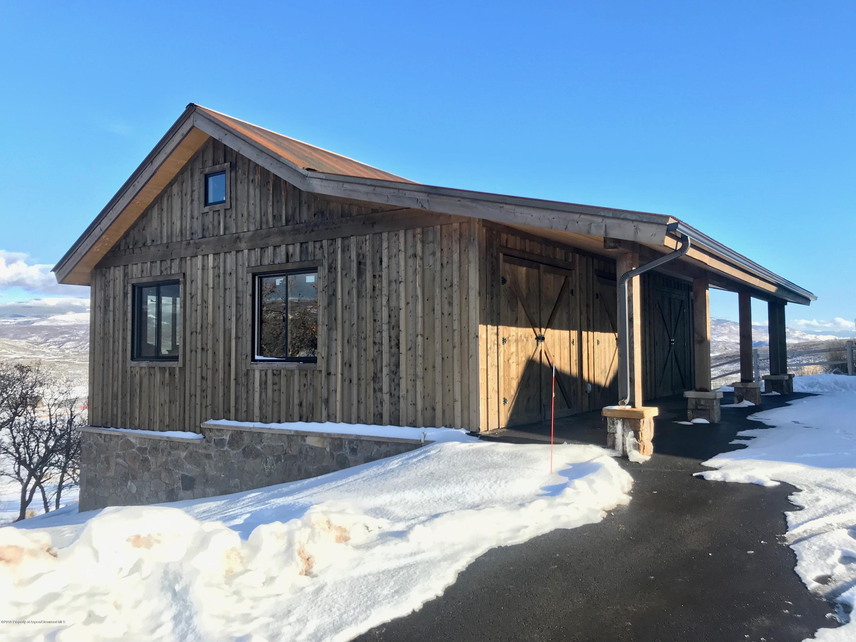 1003 Cattle Creek Ridge Road Carbondale, CO 81623 - Photo 55 of 57 a front view of a house with a yard
