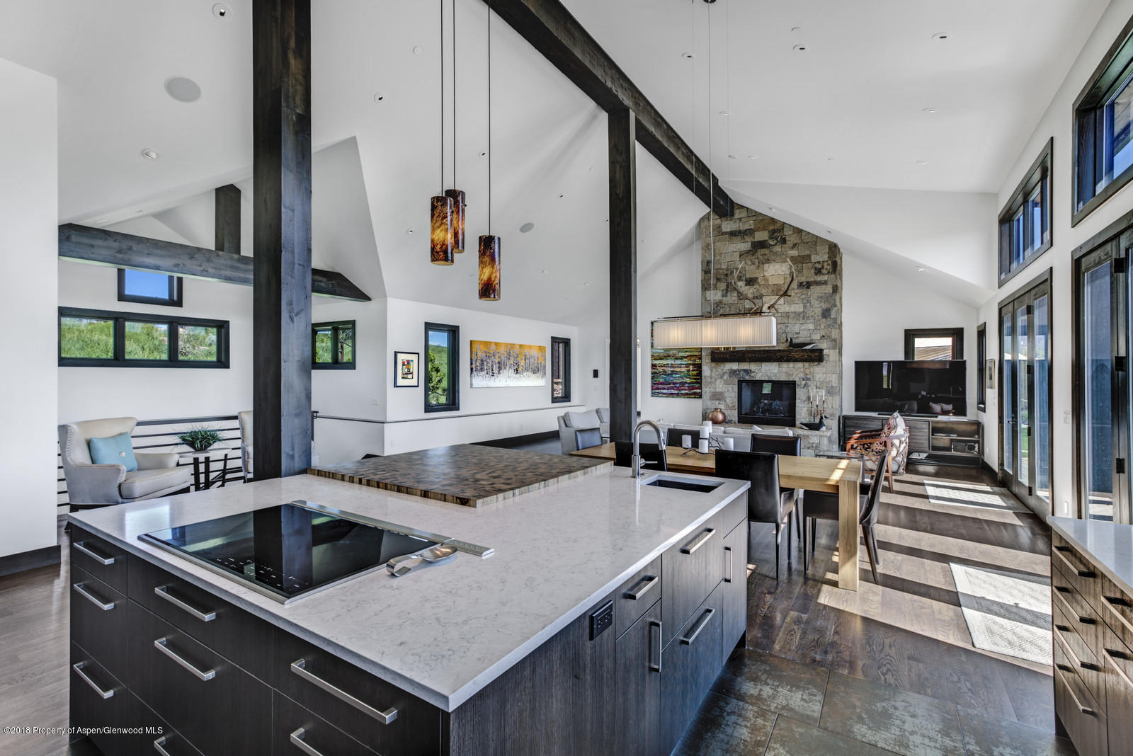 1003 Cattle Creek Ridge Road Carbondale, CO 81623 - Photo 7 of 57 a kitchen that has a lot of cabinets a sink and a stove in it