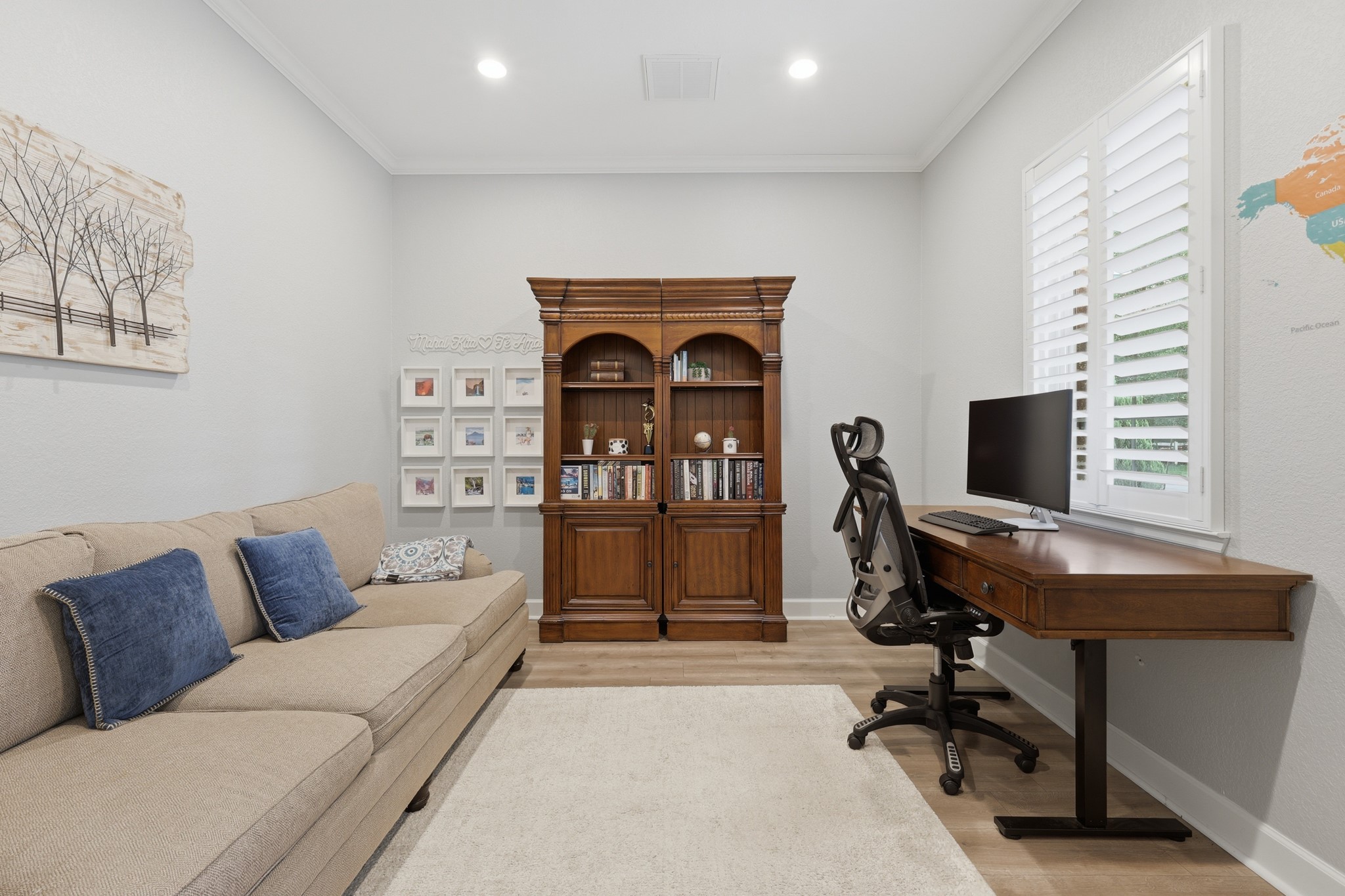 7106 Hampton Court Spring, TX 77389 - Photo 8 of 31 Cozy home office features light walls, recessed lighting, and a window with plantation shutters, creating a bright and inviting workspace.