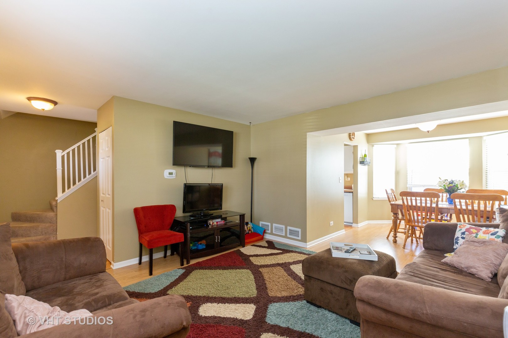 1031 Perry Drive Algonquin, IL 60102 - Photo 3 of 10 a living room with furniture a large window and a flat screen tv