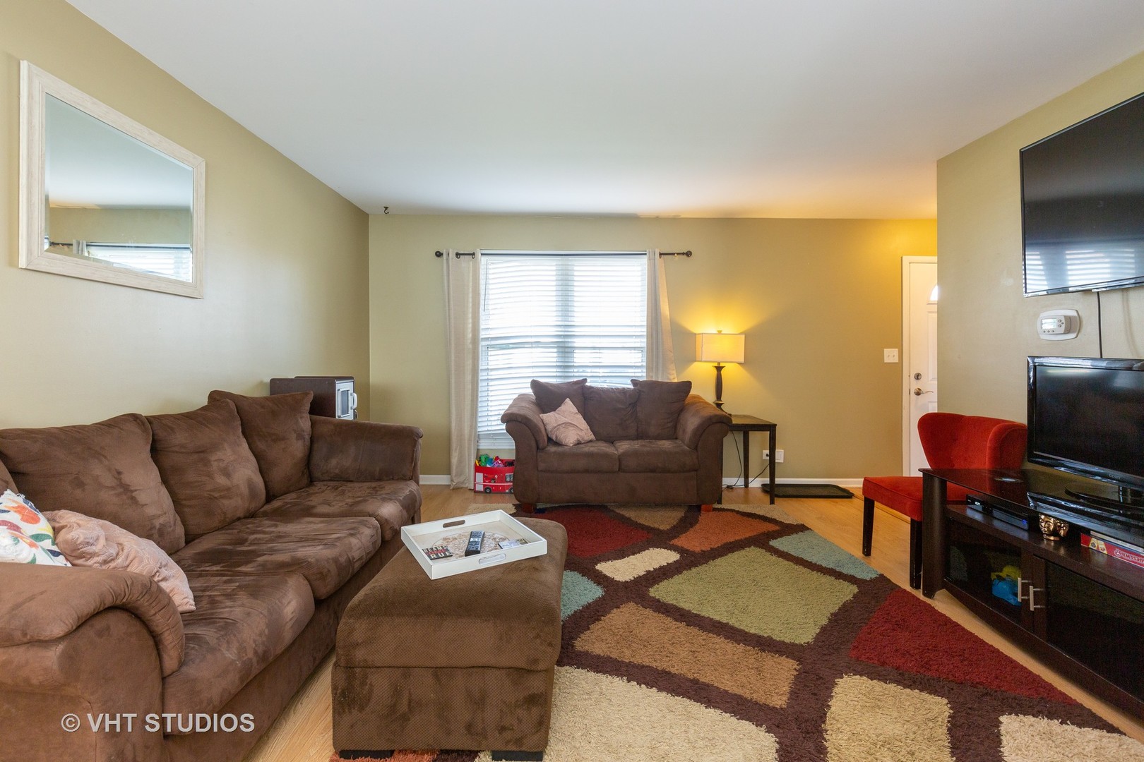 1031 Perry Drive Algonquin, IL 60102 - Photo 4 of 10 a living room with furniture and a flat screen tv